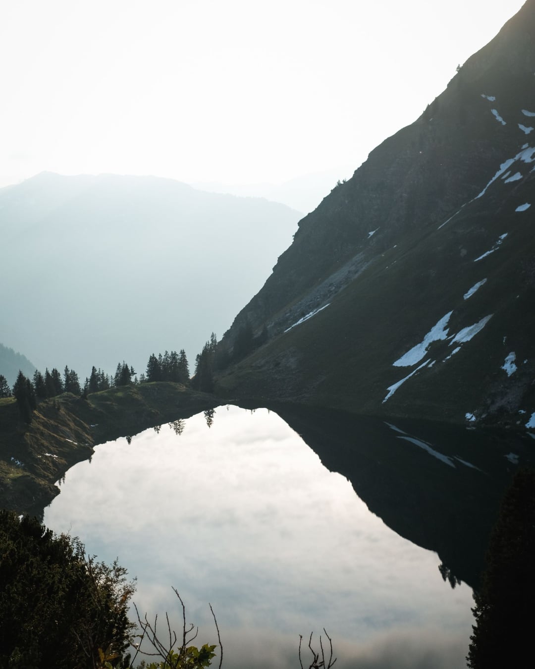 A peaceful alpine lake and mountain landscape